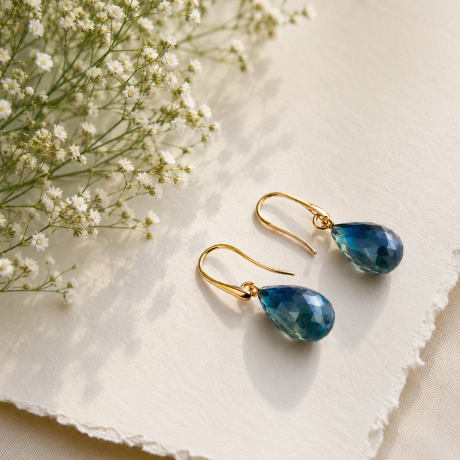 Oorsieraden met london blue pampels
