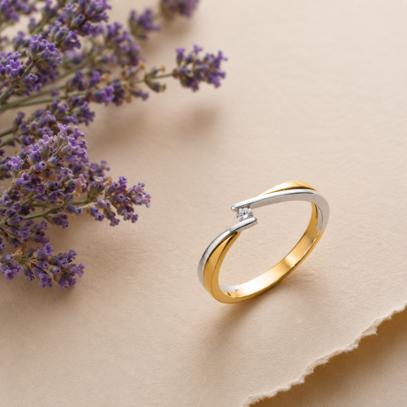 Bicolor ring met diamant in klemzetting