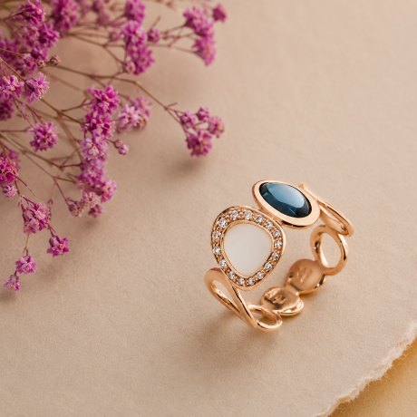 gouden ring opengewerkt met diamant en topaas
